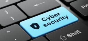 Tastiera di computer con un tasto azzurro che riporta la scritta Cyber security
